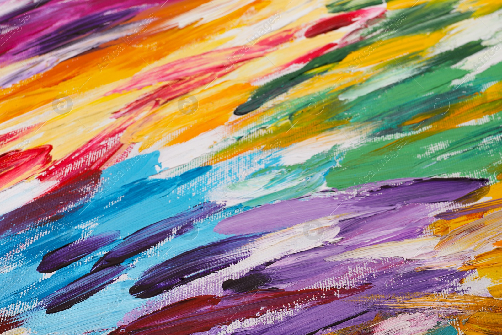 Photo of Beautiful strokes of colorful oil paints on white canvas as background, closeup