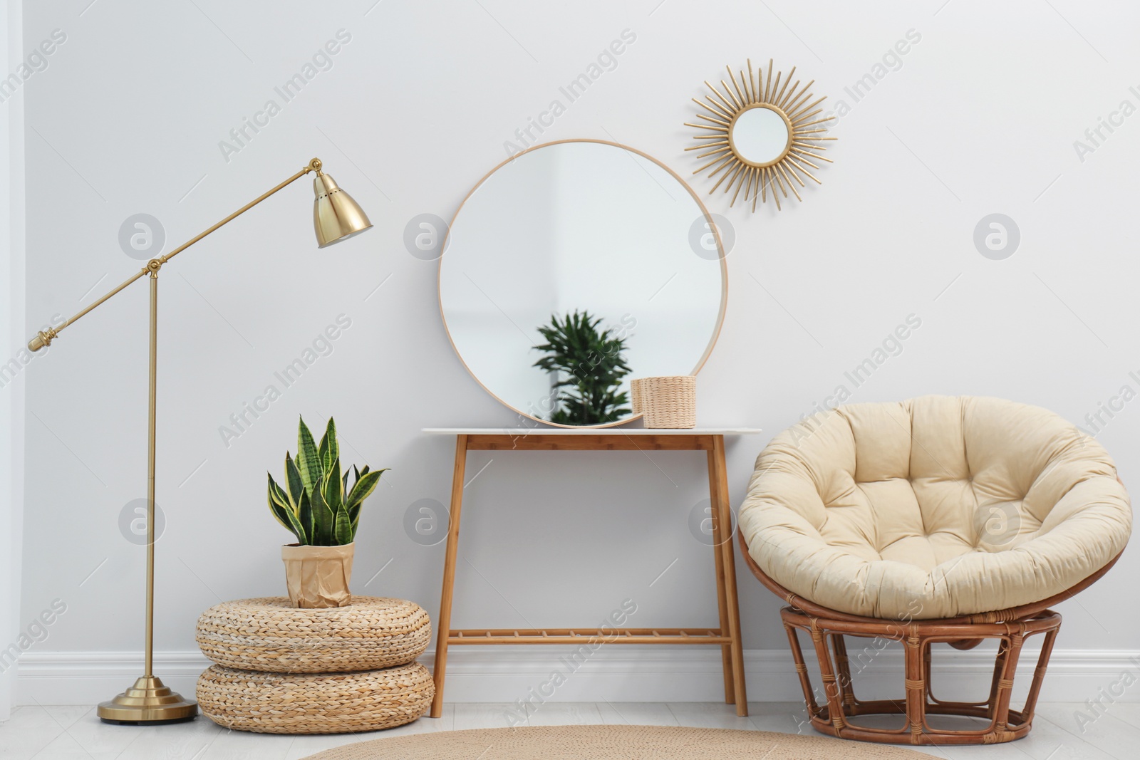 Photo of Stylish round mirror near white wall in room