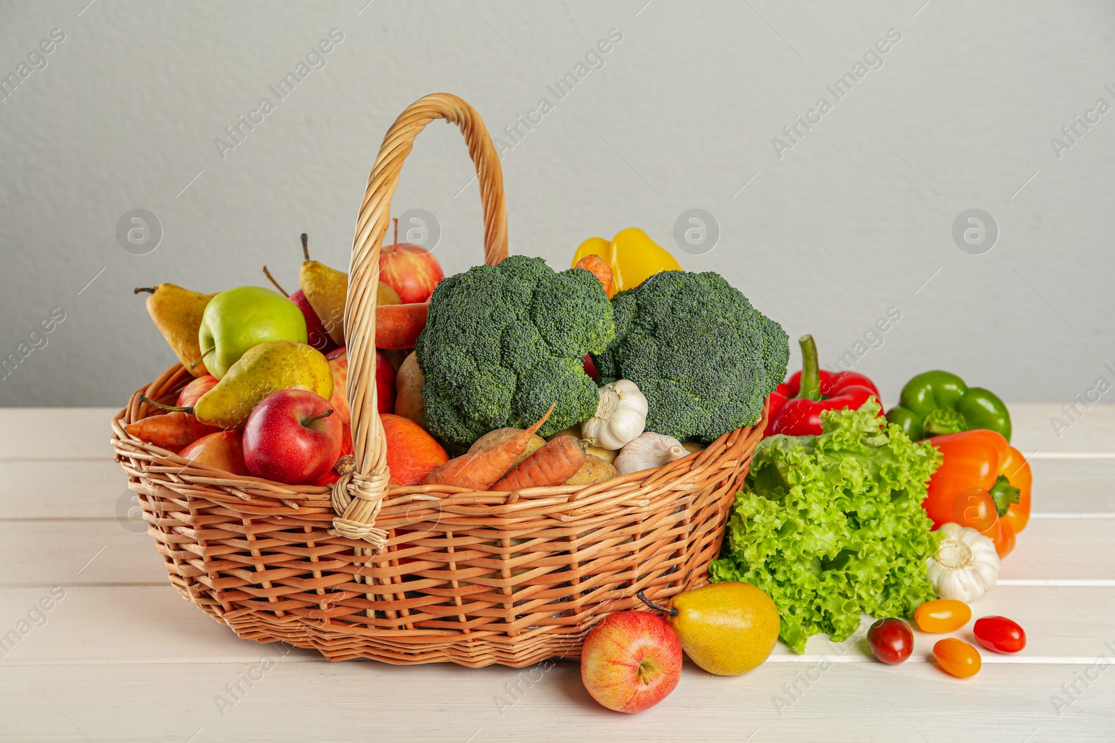Photo of Assortment of fresh vegetables and fruits on white wooden table