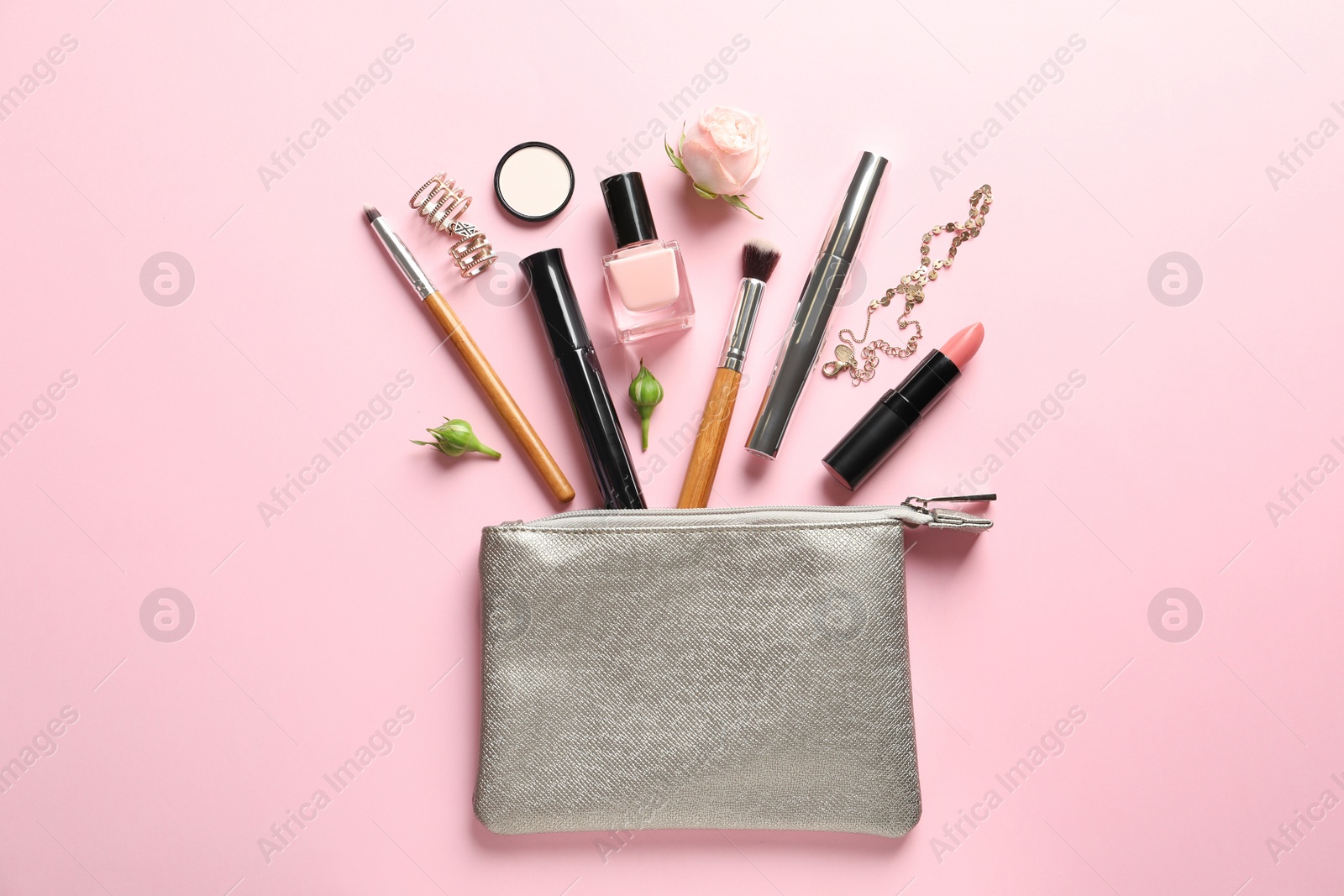 Photo of Flat lay composition with products for decorative makeup on pastel pink background
