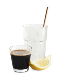 Photo of Coffee and ice cubes in different glasses, cut lemon isolated on white