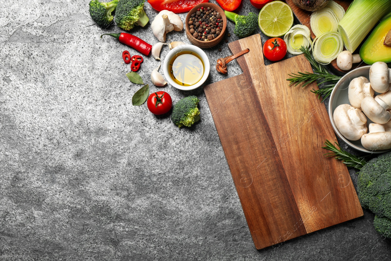 Photo of Flat lay composition with fresh products on grey table, space for text. Healthy cooking