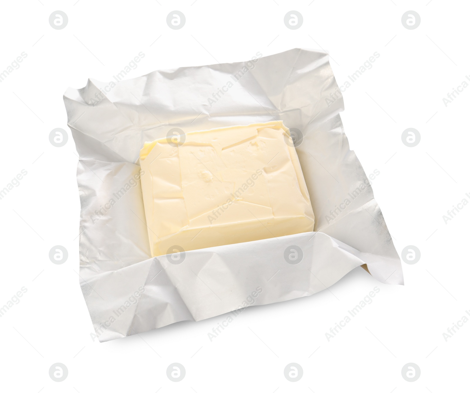 Photo of Block of tasty butter in open foil packaging isolated on white