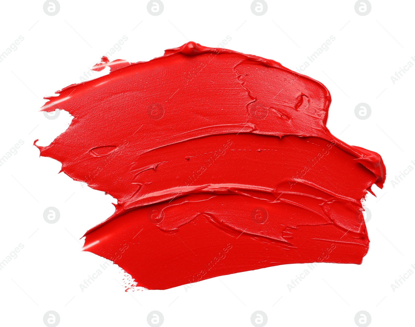 Photo of Red oil paint stroke on white background, top view