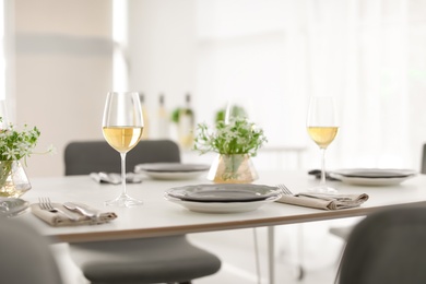 Glasses with delicious wine on table in restaurant