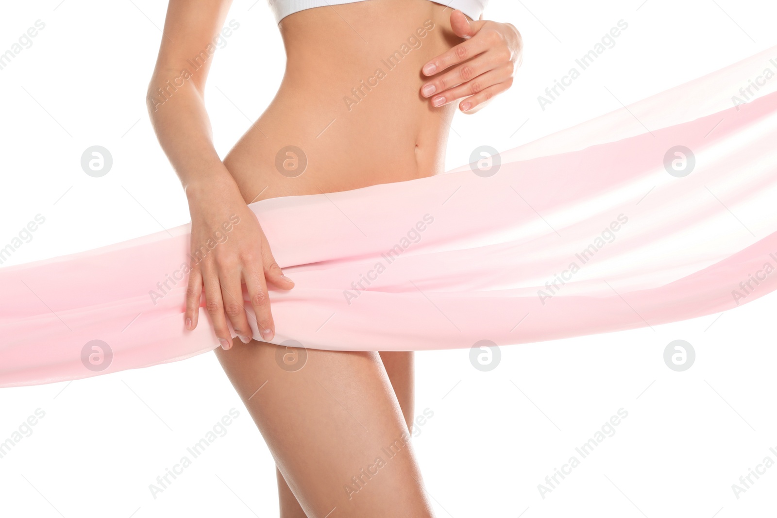Photo of Slim young woman covered with silk fabric on white background, closeup. Fit body