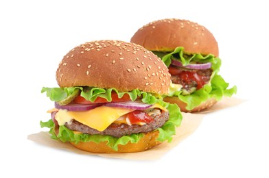 Photo of Delicious burgers with beef patty and lettuce isolated on white