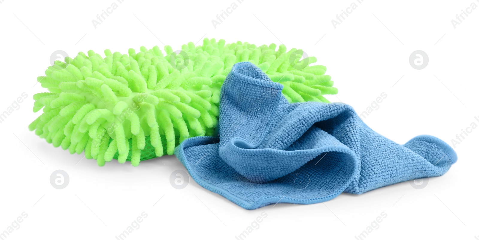 Photo of Cloth and car wash mitt on white background
