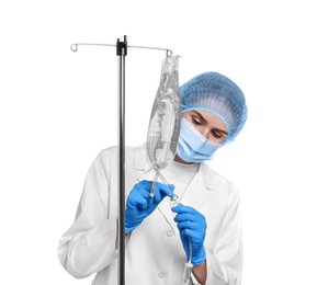 Photo of Nurse setting up IV drip on white background