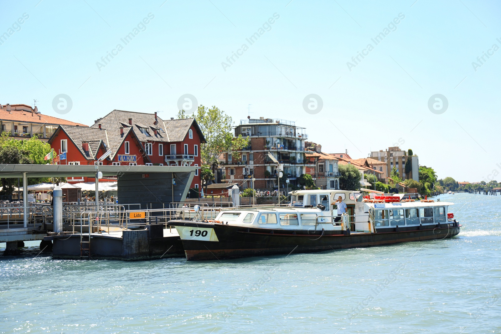 Photo of VENICE, ITALY - JUNE 13, 2019: Modern boat moored at pier