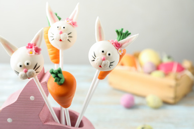 Photo of Delicious sweet cake pops on light background. Easter holiday