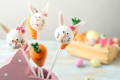 Delicious sweet cake pops on light background. Easter holiday