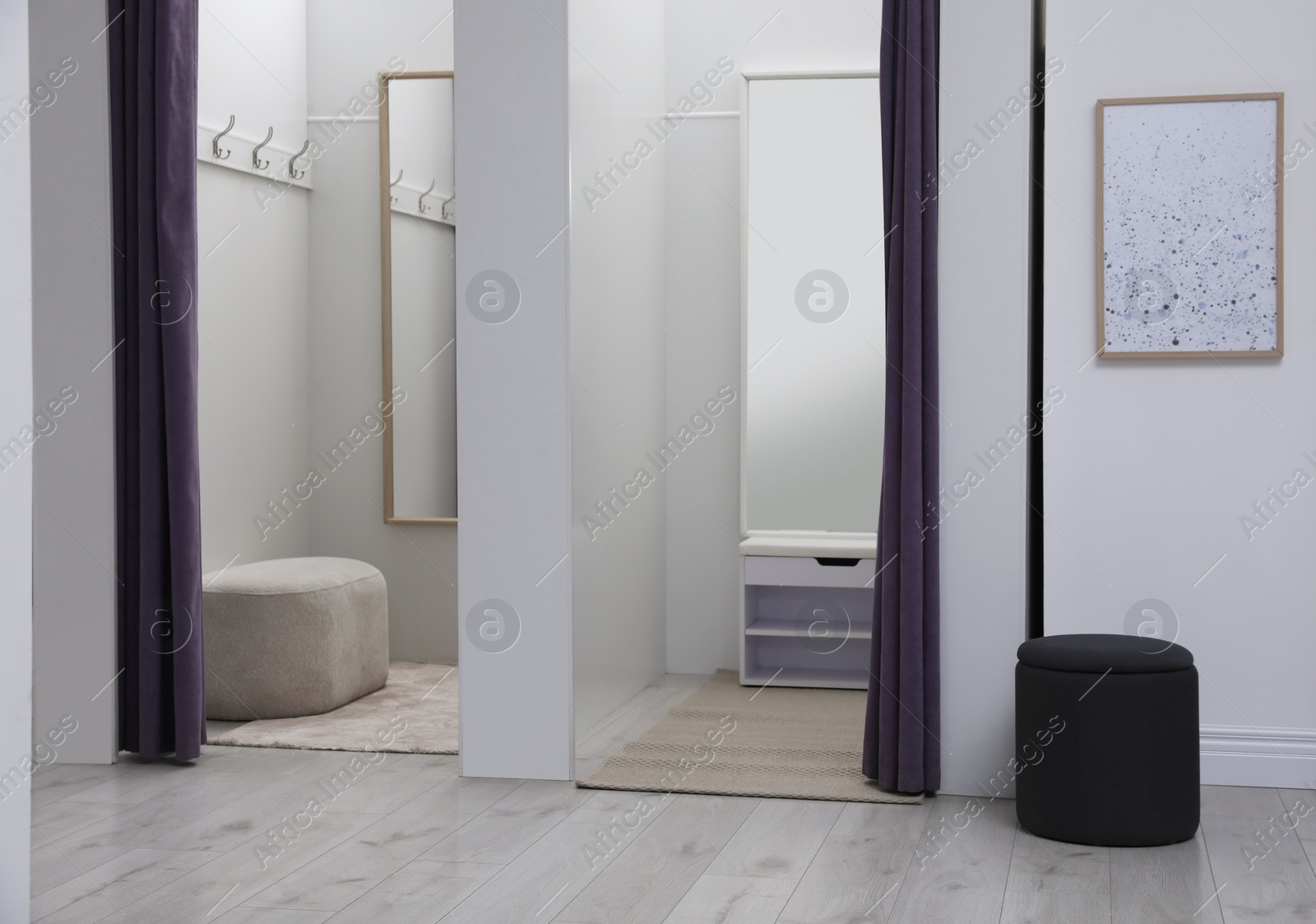 Photo of Empty dressing rooms in fashion store. Stylish interior
