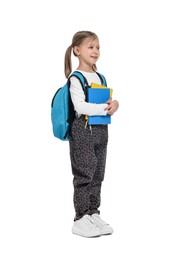 Photo of Cute schoolgirl with books on white background