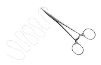 Photo of Forceps with suture thread on white background, top view. Medical equipment
