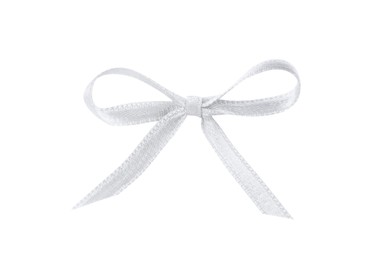 Beautiful silver ribbon tied in bow isolated on white, top view