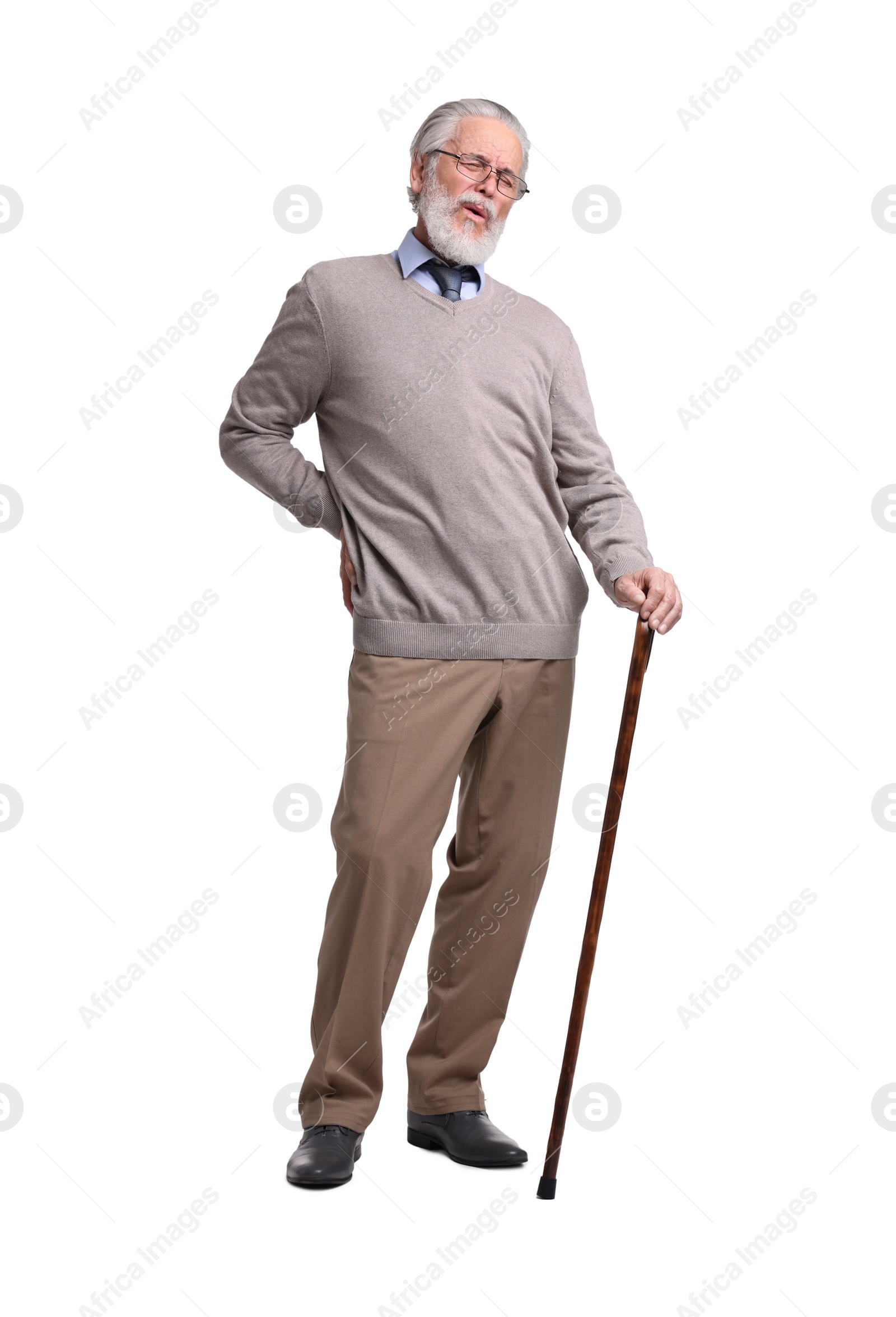 Photo of Senior man with walking cane suffering from back pain on white background