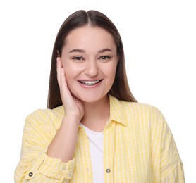 Smiling woman with dental braces on white background