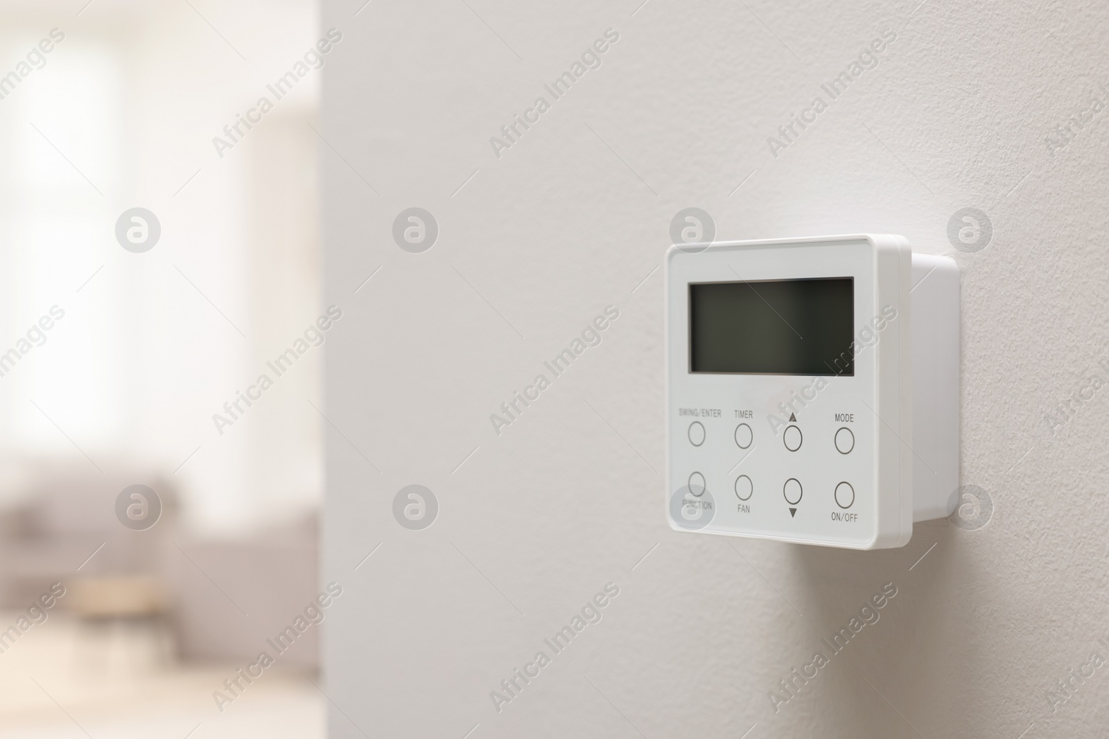 Photo of One thermostat on white wall indoors, space for text. Smart home system