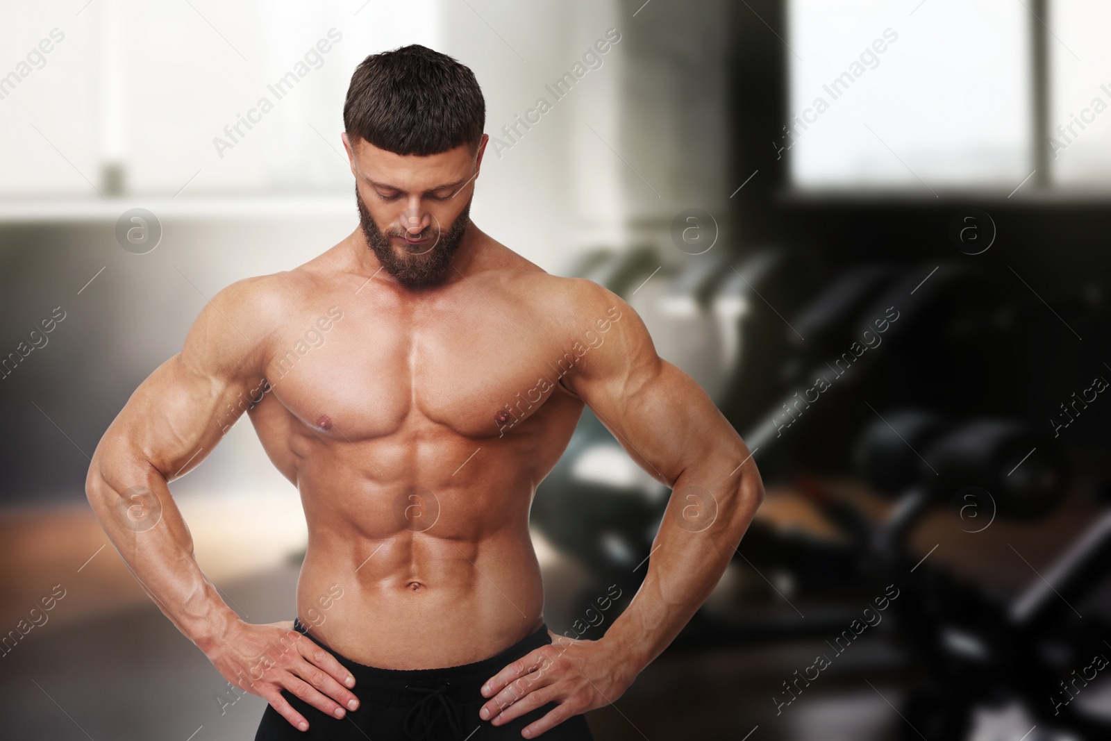 Image of Handsome bodybuilder with muscular body in gym, space for text