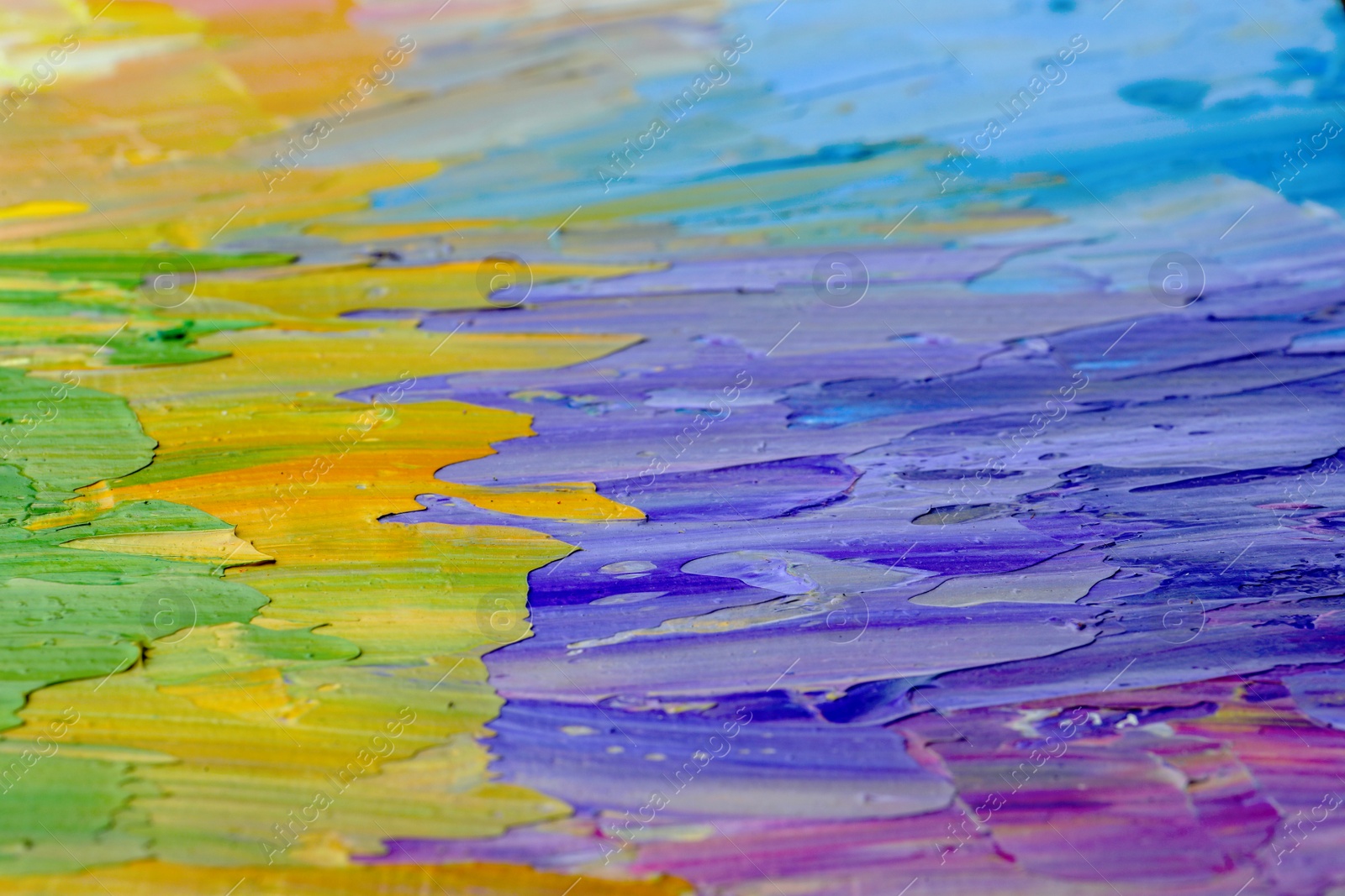 Photo of Beautiful strokes of pastel oil paints as background, closeup