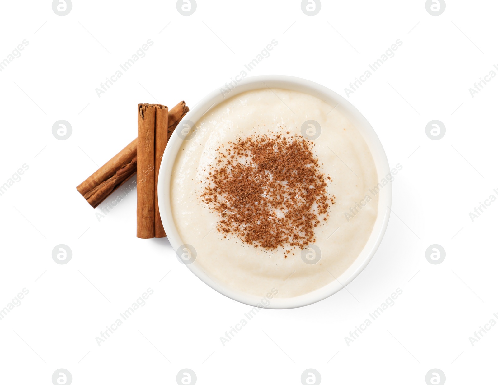 Photo of Delicious semolina pudding with cinnamon on white background, top view