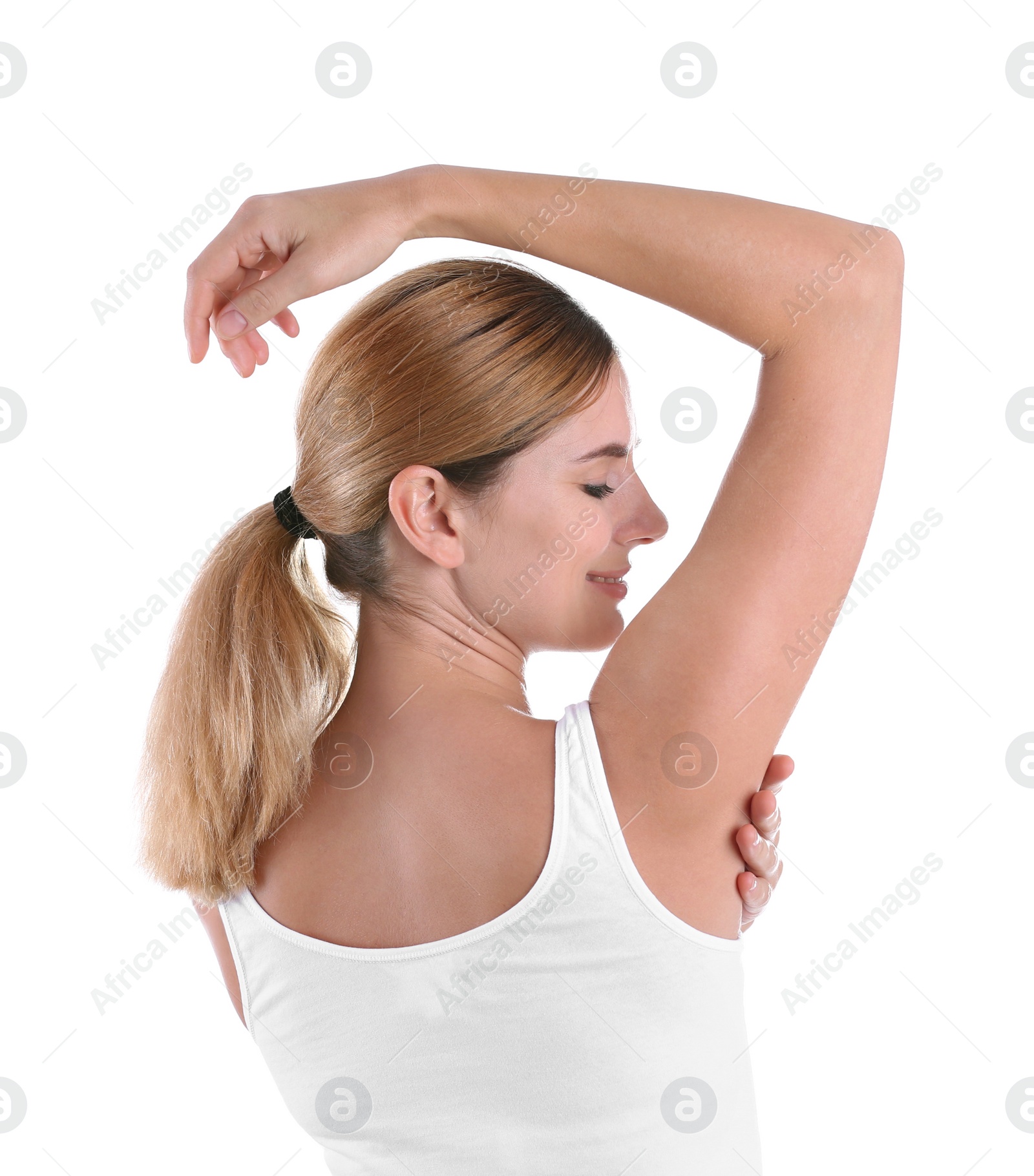 Photo of Young woman showing armpit on white background. Using deodorant