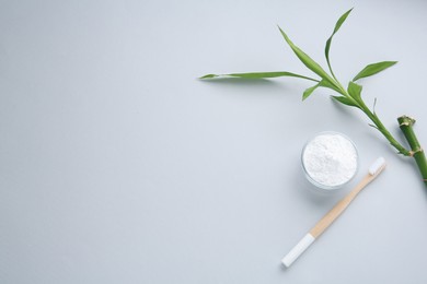 Photo of Tooth powder, brush and bamboo stem on white background, flat lay. Space for text
