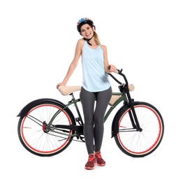 Photo of Portrait of sporty woman with bicycle on white background