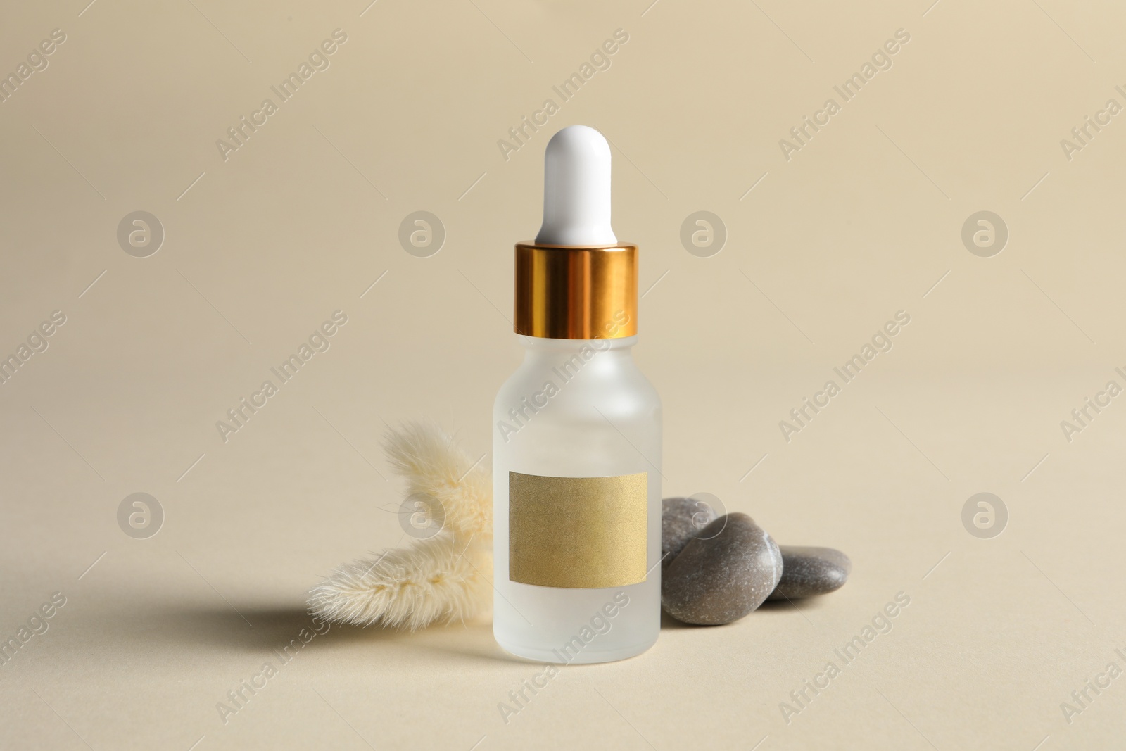 Photo of Composition with bottlecosmetic serum on beige background