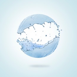 Sphere made of water splashes on light blue background