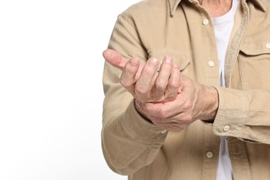 Photo of Arthritis symptoms. Man suffering from pain in hand on white background, closeup