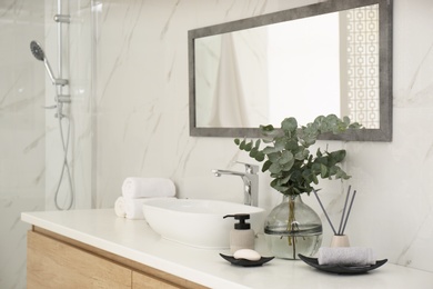 Photo of Modern bathroom interior with stylish mirror and vessel sink