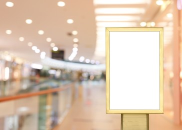 Blank advertising board in shopping mall. Mockup for design