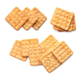 Set of tasty crispy crackers on white background, top view