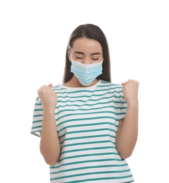 Photo of Emotional woman with protective mask on white background. Strong immunity concept