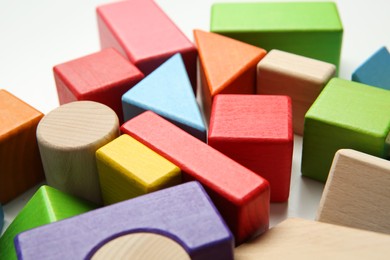 Photo of Wooden construction set on white background, closeup