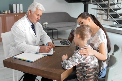 Young woman with her son having appointment at child psychologist office