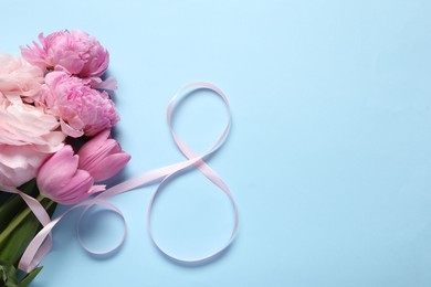 Photo of 8th of March greeting card design with pink ribbon, beautiful flowers and space for text on light blue background, flat lay. International Women's day