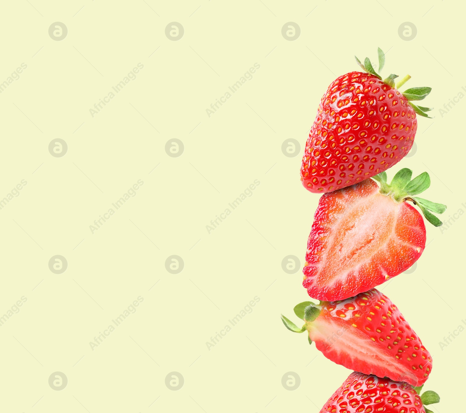 Image of Stack of fresh strawberries on beige background, space for text