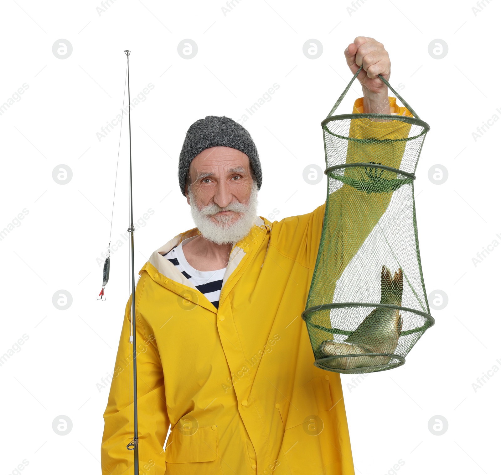 Photo of Fisherman holding rod and fishing net with catch isolated on white