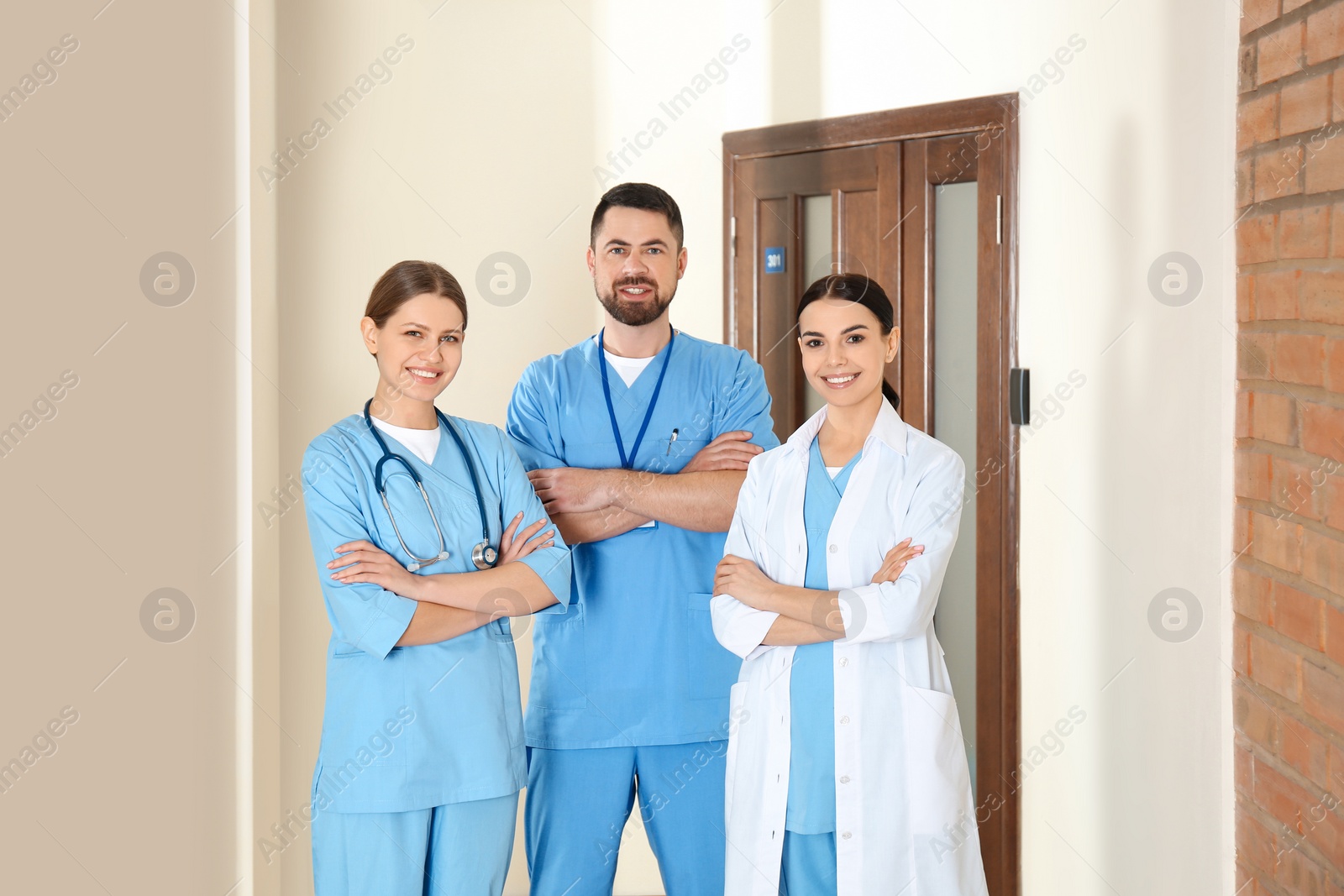 Photo of Group of doctors walking in clinic. Medical service