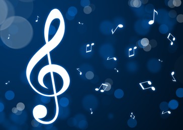 Treble clef and music notes flying on blue background, bokeh effect. Beautiful illustration design