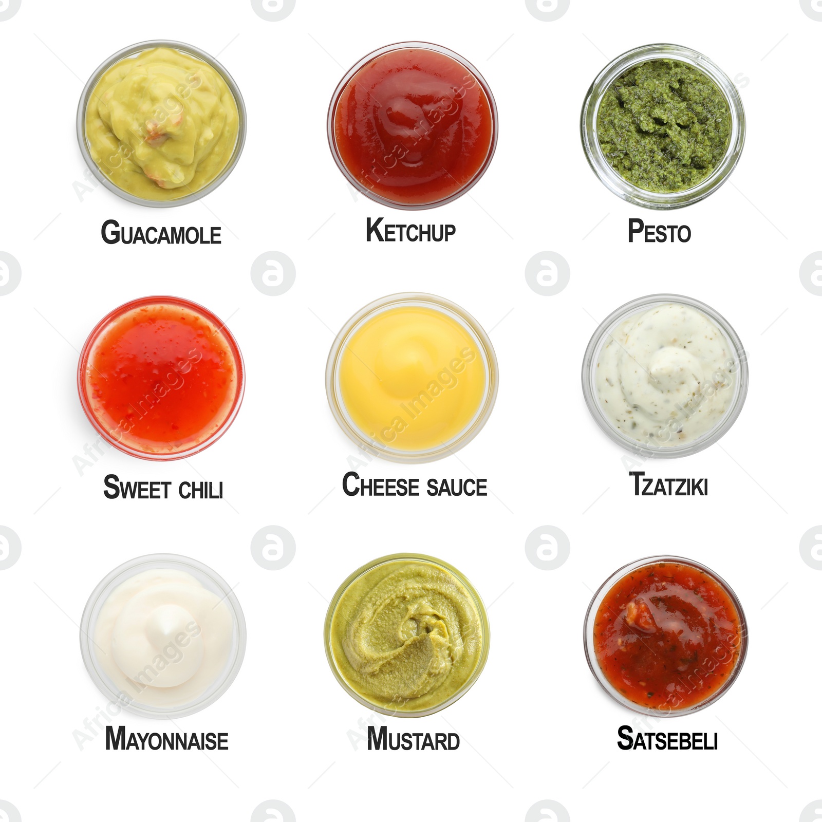 Image of Set of different sauces in bowls and names isolated on white, top view