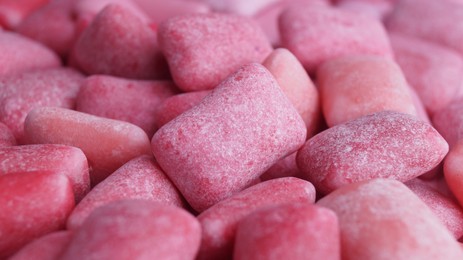 Many pink chewing gums as background, closeup