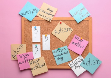 Photo of Sticky notes with autism related phrases on cork board