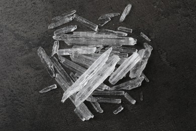 Menthol crystals on grey background, flat lay
