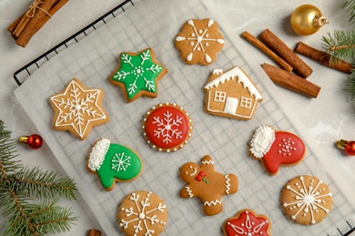 Tasty homemade Christmas cookies on parchment paper, top view