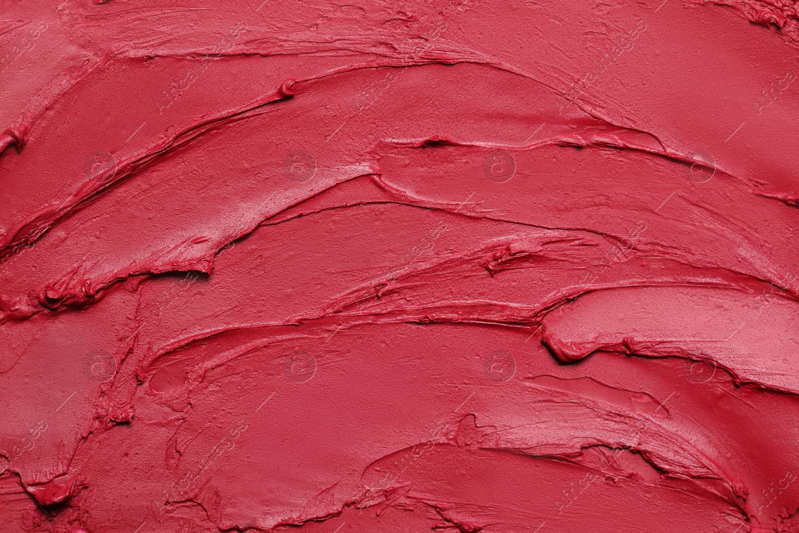 Photo of Texture of red lipstick as background, top view