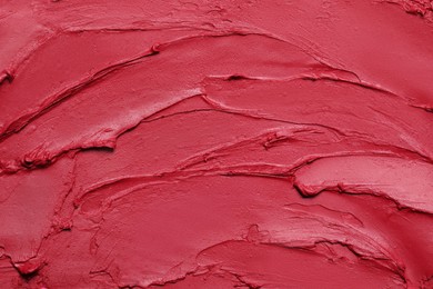 Photo of Texture of red lipstick as background, top view